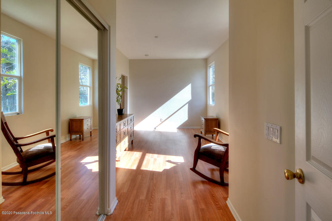 7461 Chanteclair Court Tujunga, CA 91042 - Photo 15 of 44 a view of hallway with wooden floor and stairs