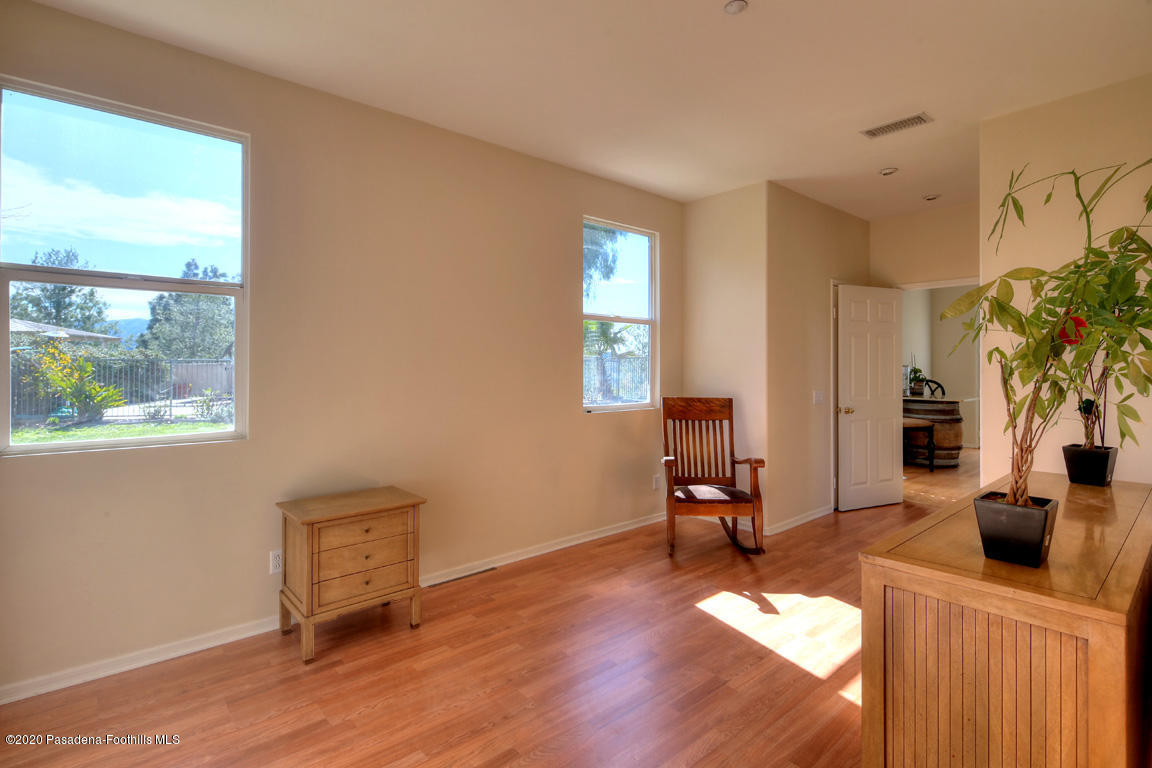 7461 Chanteclair Court Tujunga, CA 91042 - Photo 16 of 44 a living room with furniture and a window