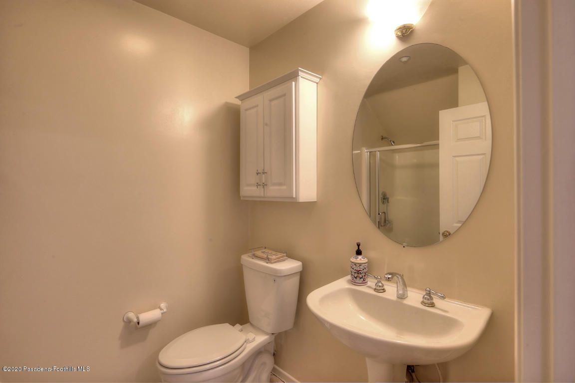 7461 Chanteclair Court Tujunga, CA 91042 - Photo 18 of 44 a bathroom with a toilet a sink and mirror
