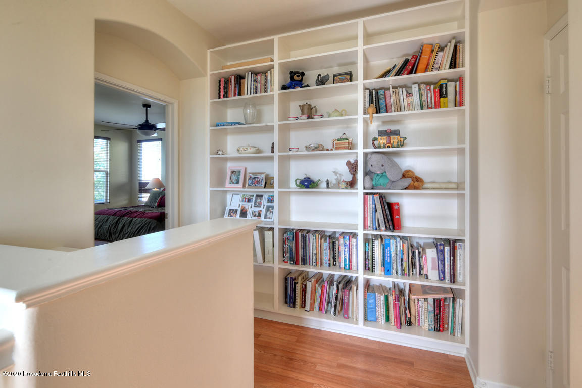 7461 Chanteclair Court Tujunga, CA 91042 - Photo 20 of 44 a living room with a bookshelf and a book shelf