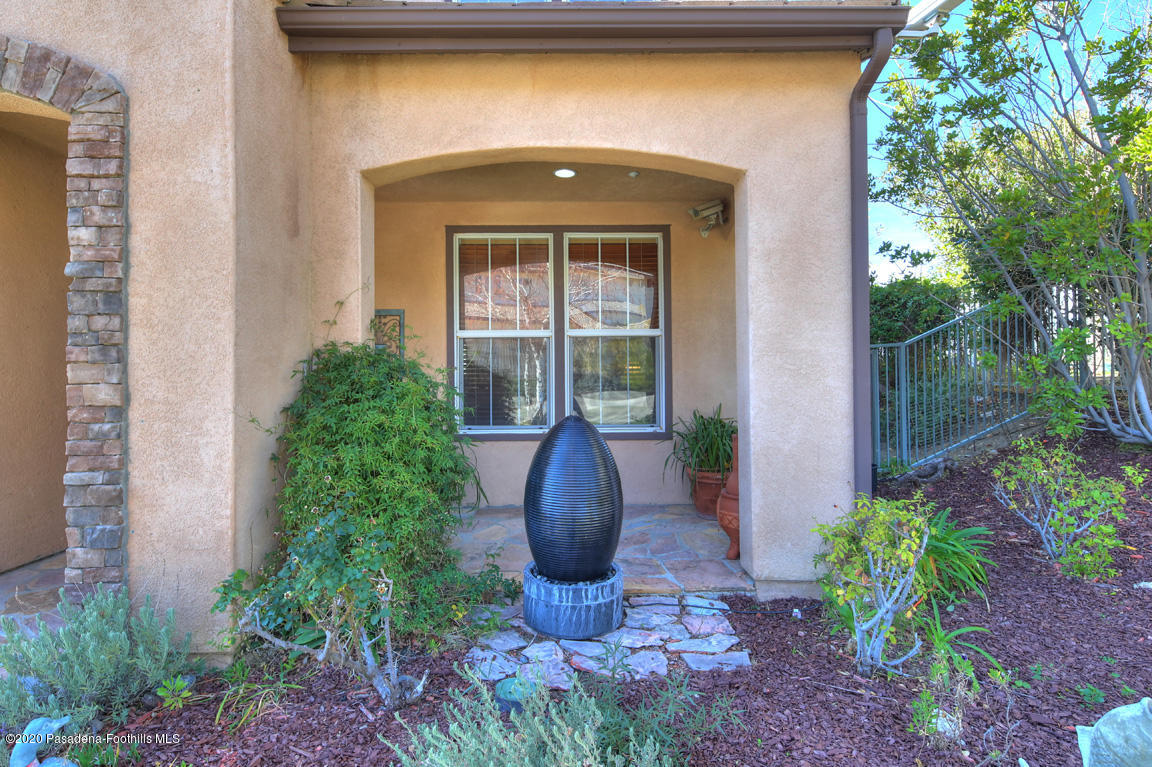 7461 Chanteclair Court Tujunga, CA 91042 - Photo 3 of 44 a front view of a house with garden