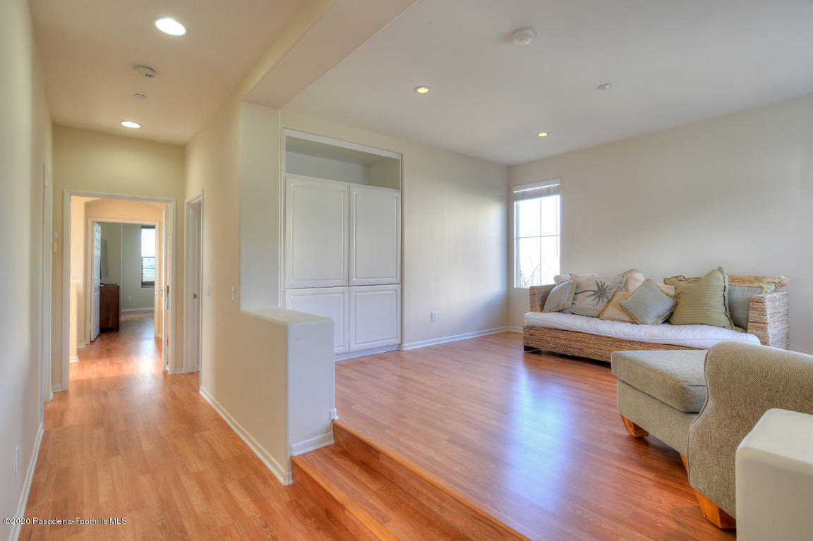 7461 Chanteclair Court Tujunga, CA 91042 - Photo 22 of 44 a living room with furniture and a wooden floor