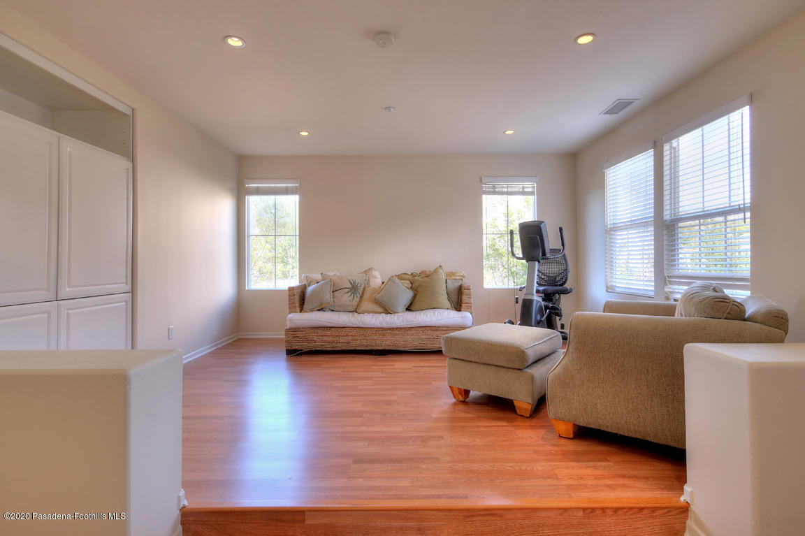 7461 Chanteclair Court Tujunga, CA 91042 - Photo 23 of 44 a living room with furniture and a large window
