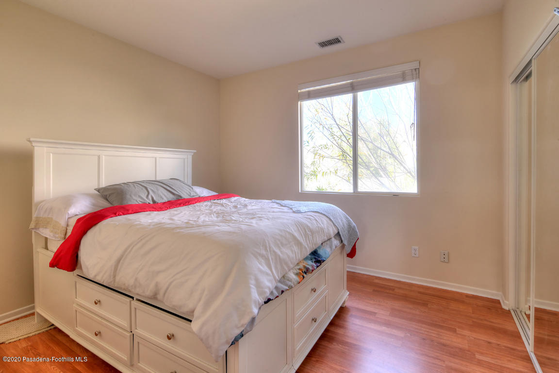 7461 Chanteclair Court Tujunga, CA 91042 - Photo 24 of 44 a bedroom with a bed and a window