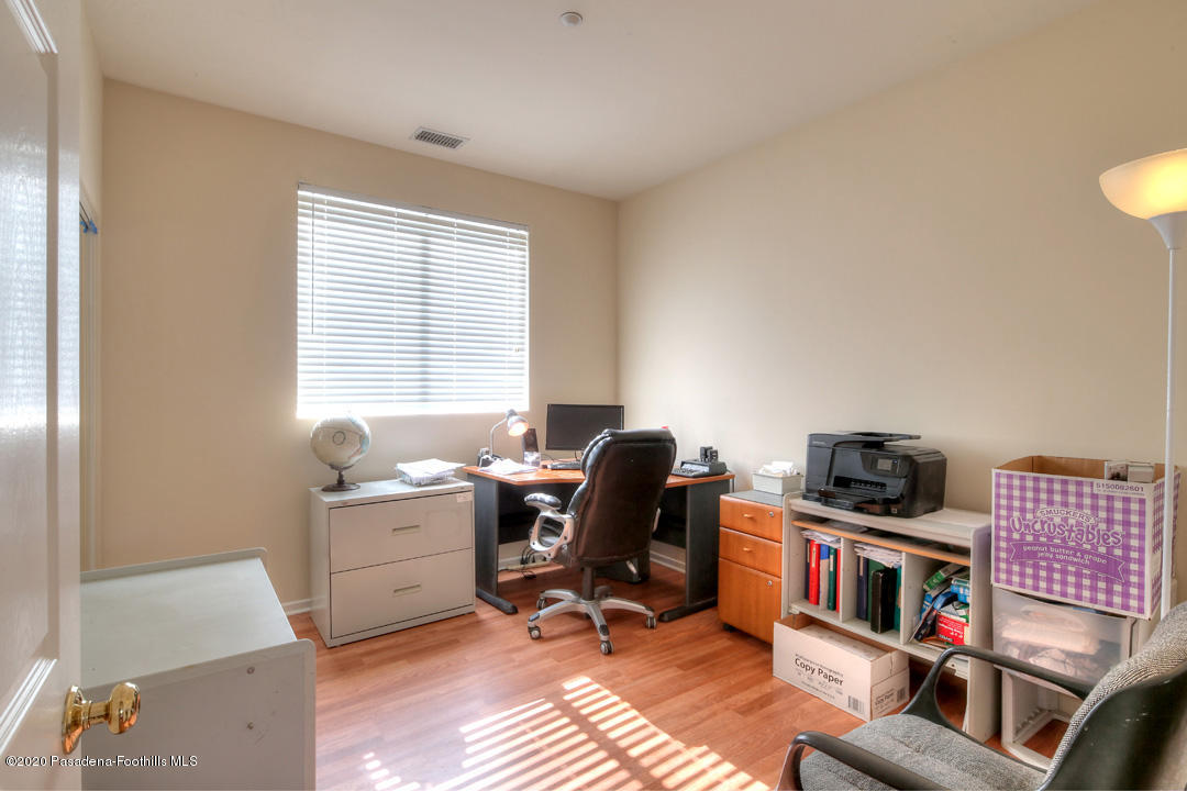 7461 Chanteclair Court Tujunga, CA 91042 - Photo 26 of 44 a view of a workspace with furniture and a window
