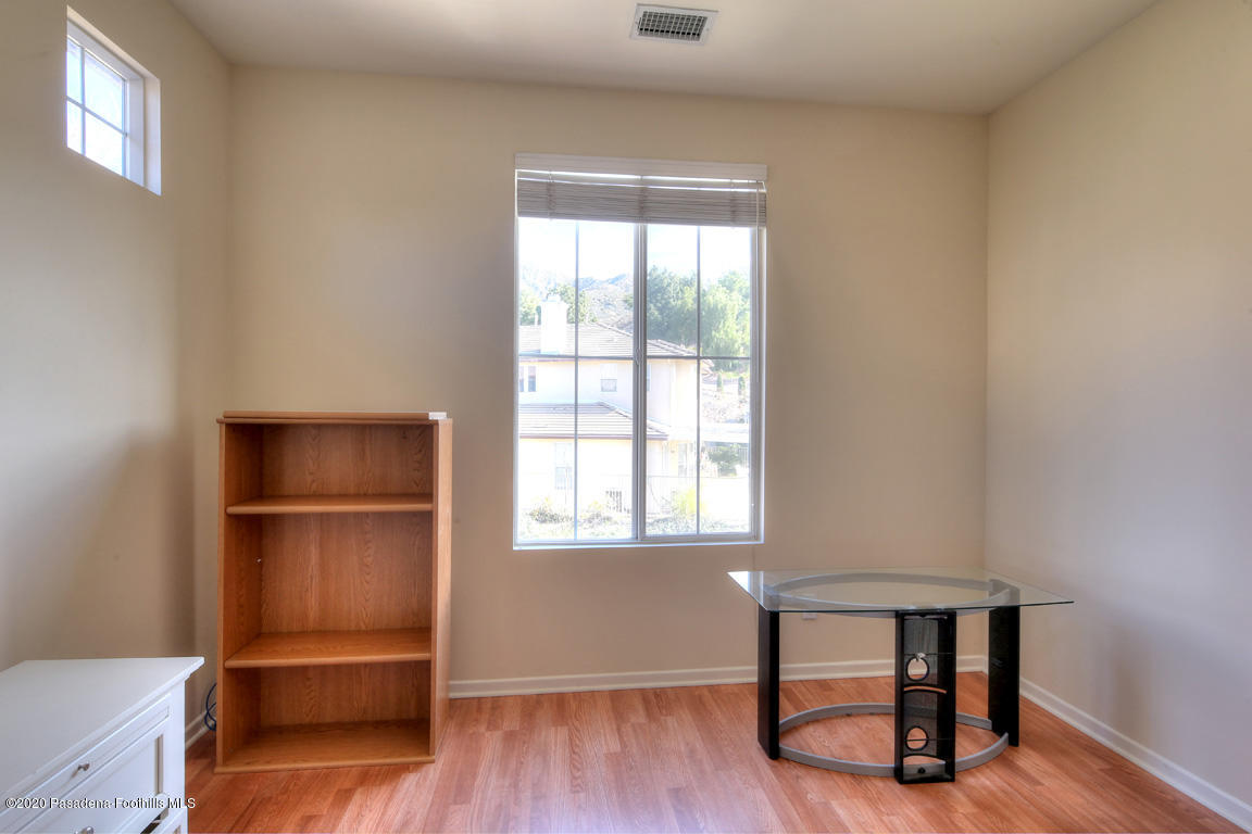 7461 Chanteclair Court Tujunga, CA 91042 - Photo 27 of 44 a room that has a window and chair
