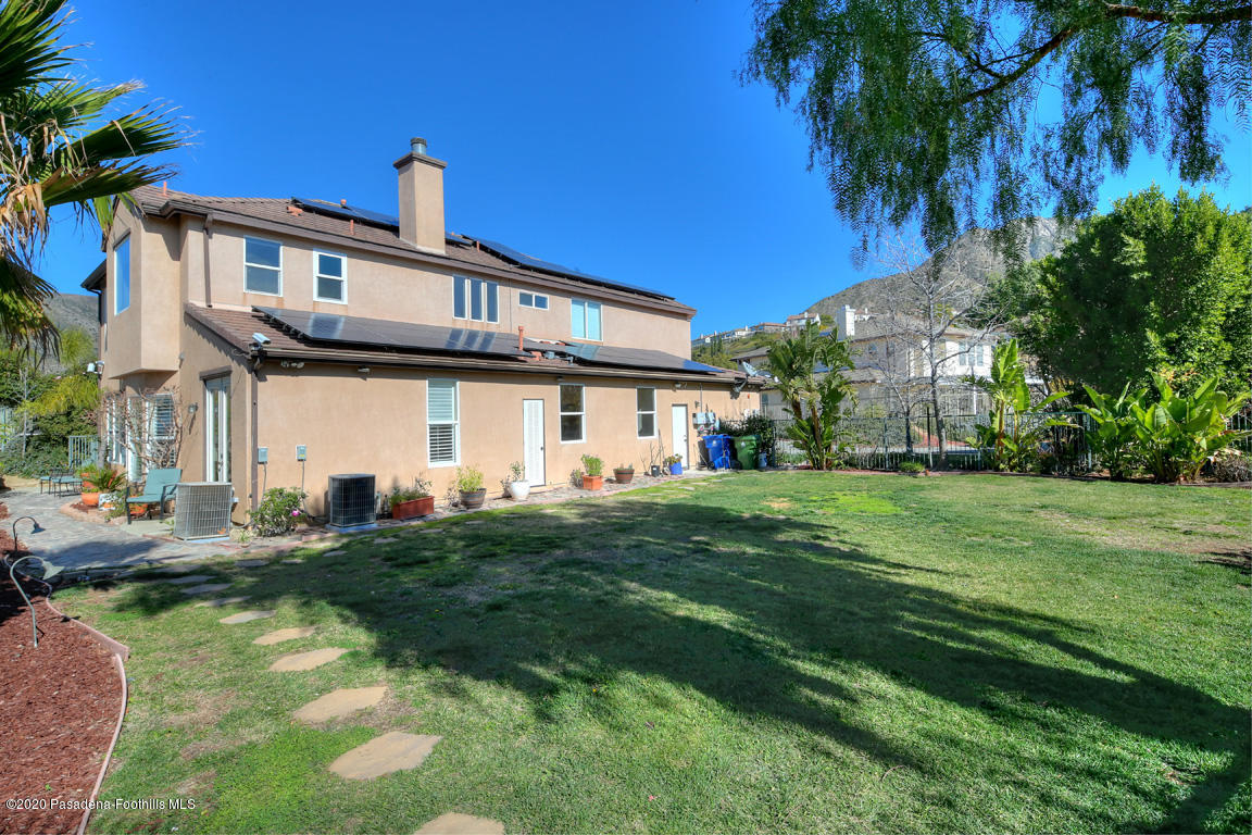 7461 Chanteclair Court Tujunga, CA 91042 - Photo 29 of 44 a front view of a house with a garden