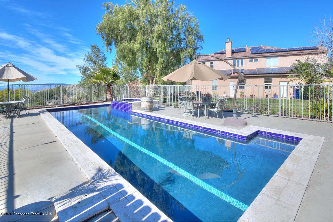 7461 Chanteclair Court Tujunga, CA 91042 - Photo 31 of 44 a view of a swimming pool with a patio