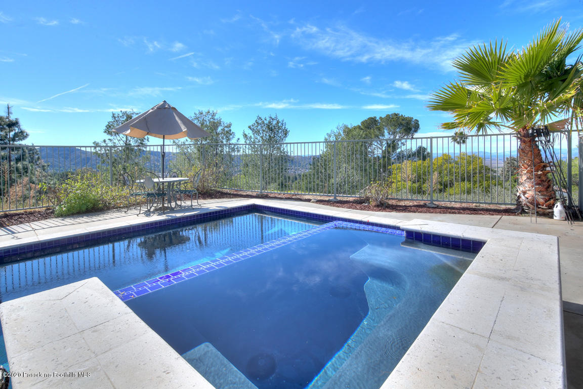 7461 Chanteclair Court Tujunga, CA 91042 - Photo 33 of 44 a view of a swimming pool with a patio