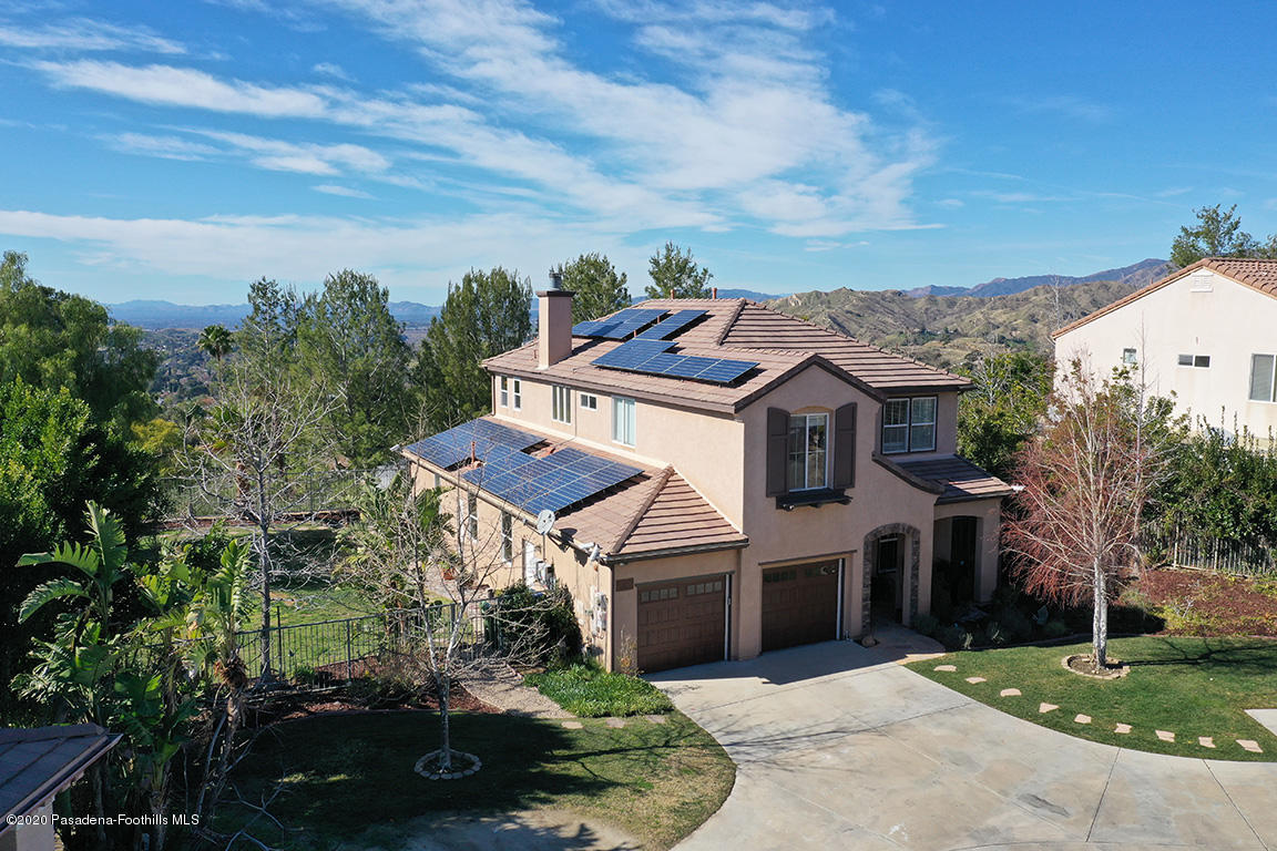 7461 Chanteclair Court Tujunga, CA 91042 - Photo 34 of 44 a front view of a house with a garden