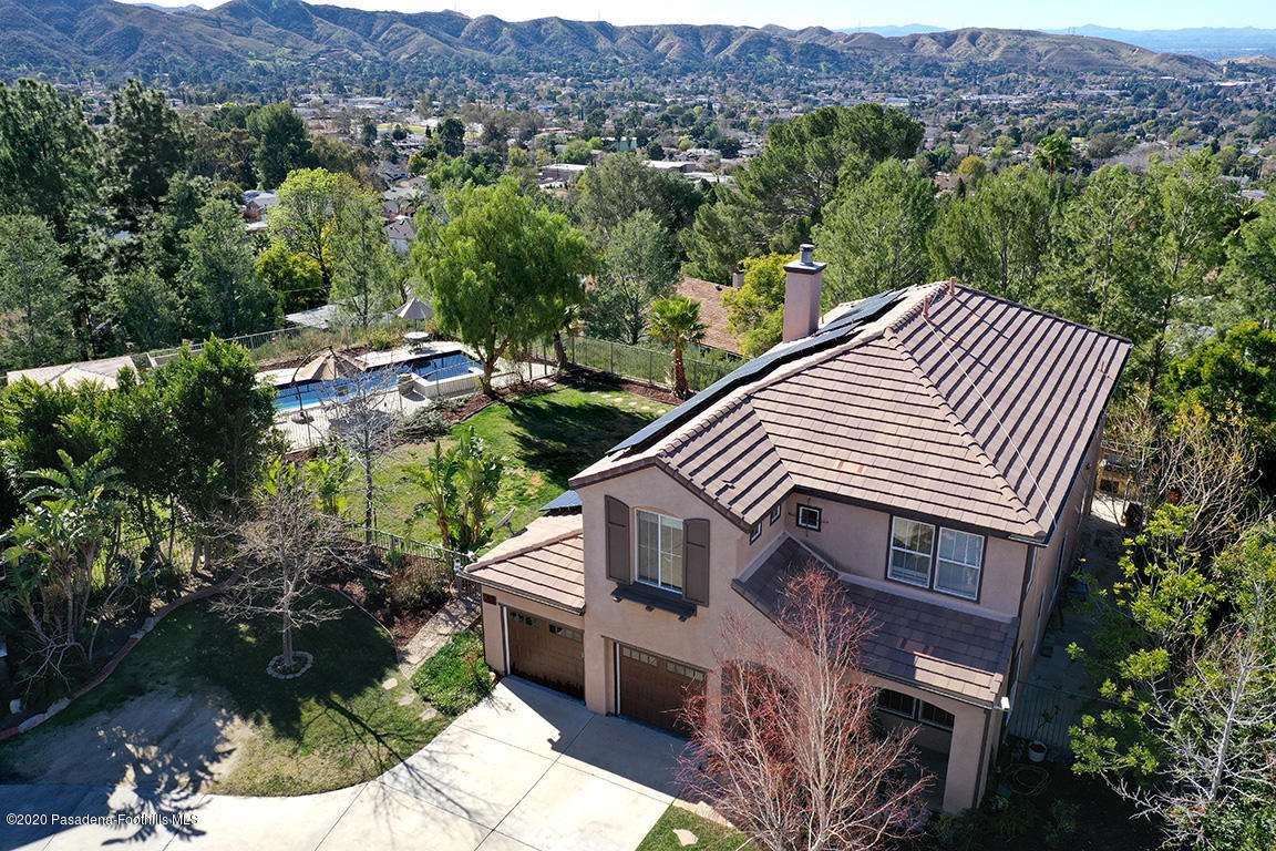 7461 Chanteclair Court Tujunga, CA 91042 - Photo 40 of 44 an aerial view of a house with a yard and mountain view in back