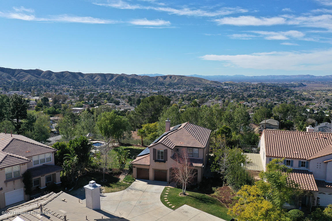 7461 Chanteclair Court Tujunga, CA 91042 - Photo 42 of 44 a view of a house with a yard and mountain