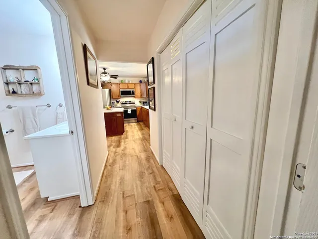 a view of a storage and utility room with washer and dryer