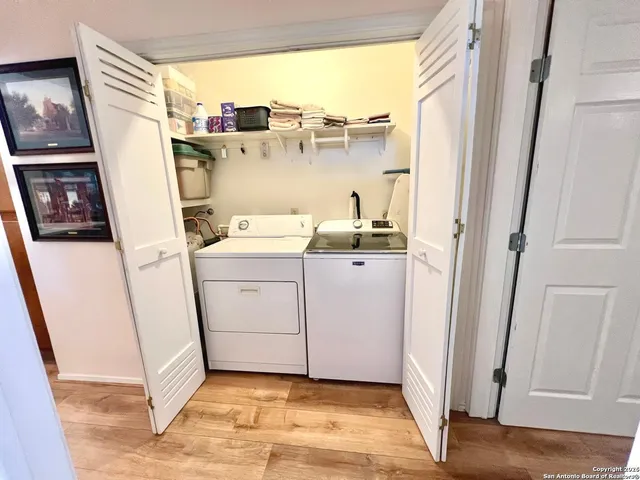a view of an entryway with wooden floor