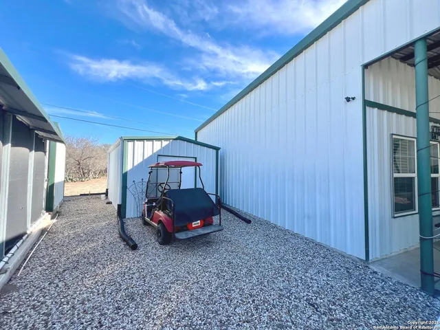 a view of a backyard of the house