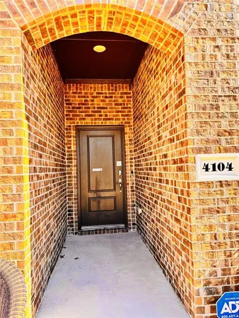 a view of entryway with brick walls