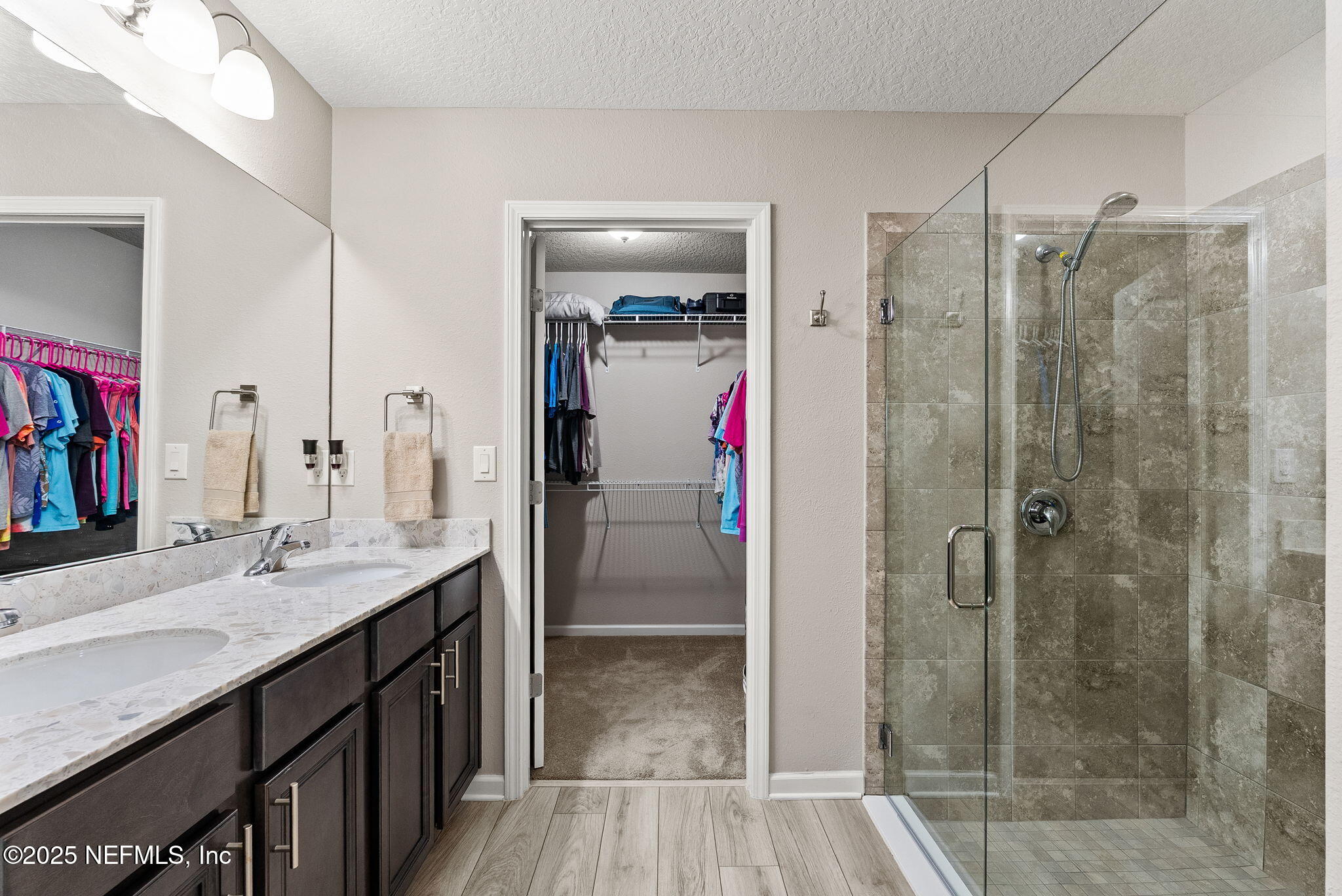 3961 Heatherbrook Place Middleburg, FL 32068 - Photo 12 of 28 a bathroom with a shower sink and mirror