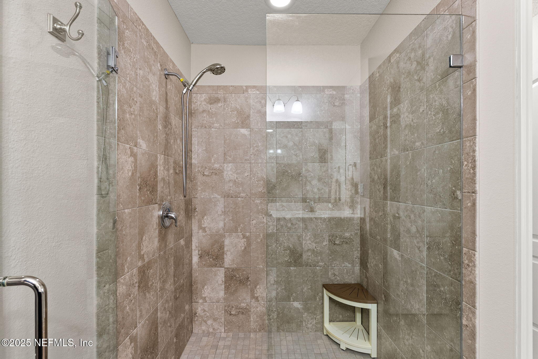 3961 Heatherbrook Place Middleburg, FL 32068 - Photo 14 of 28 a bathroom with a shower