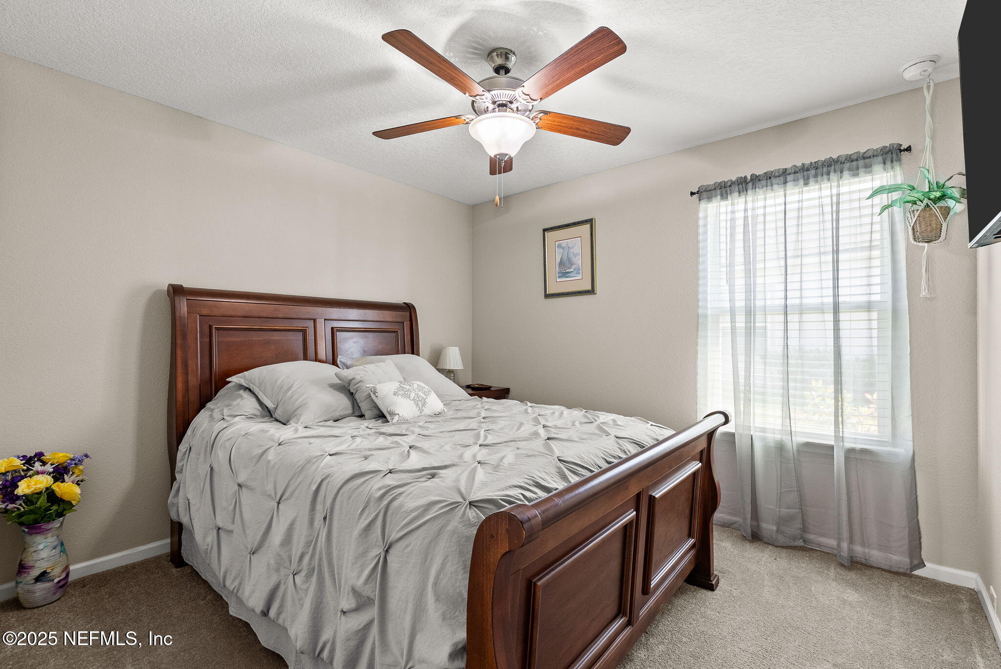 3961 Heatherbrook Place Middleburg, FL 32068 - Photo 15 of 28 a bedroom with a bed and window