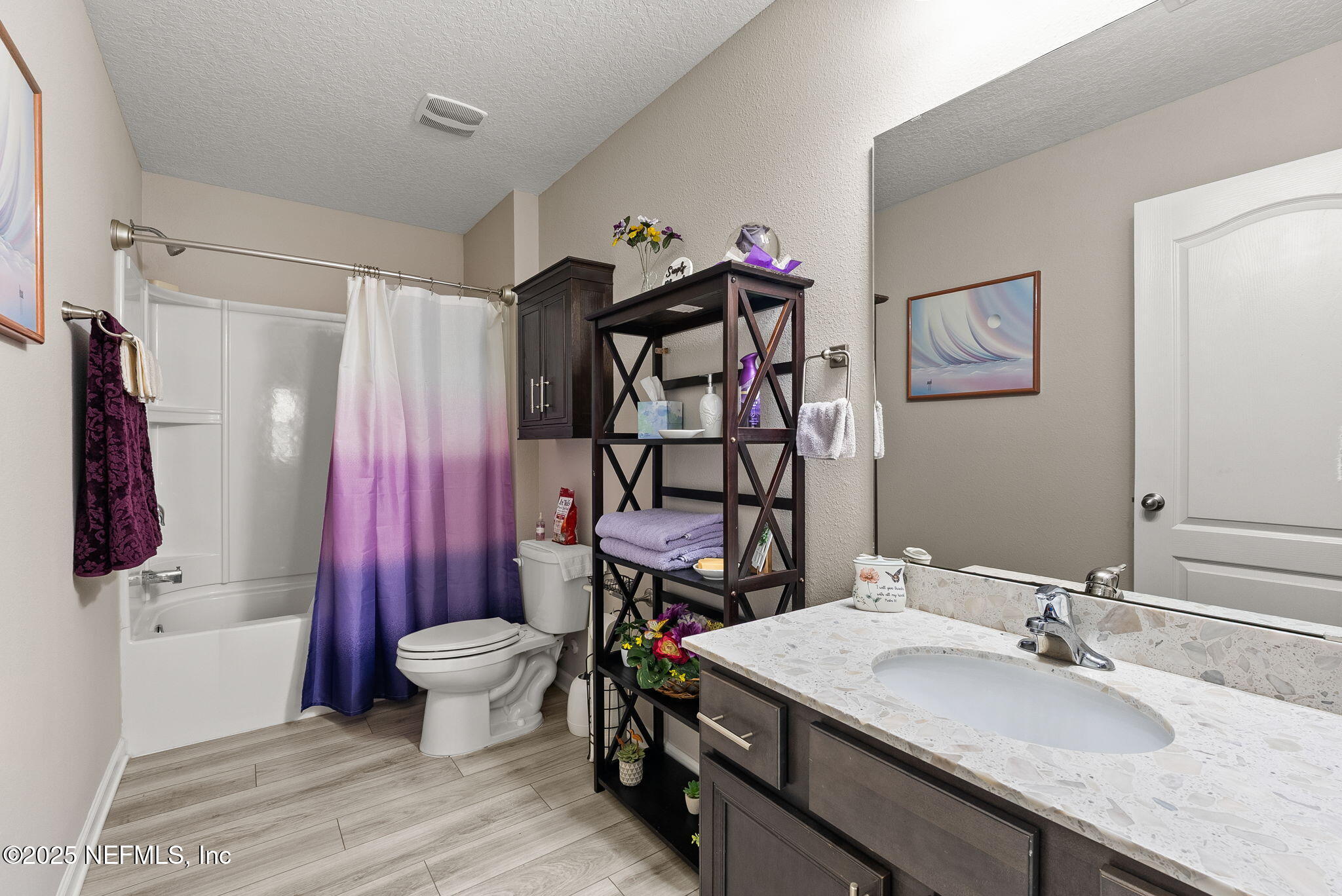 3961 Heatherbrook Place Middleburg, FL 32068 - Photo 17 of 28 a bathroom with a sink toilet and shower