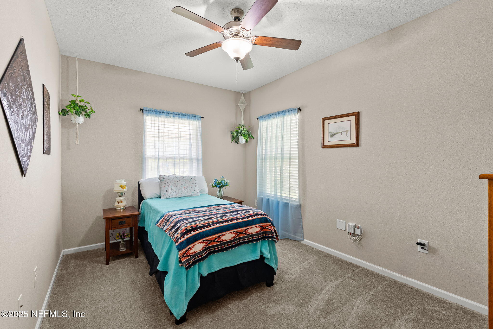 3961 Heatherbrook Place Middleburg, FL 32068 - Photo 18 of 28 a room with a bed and a chandelier
