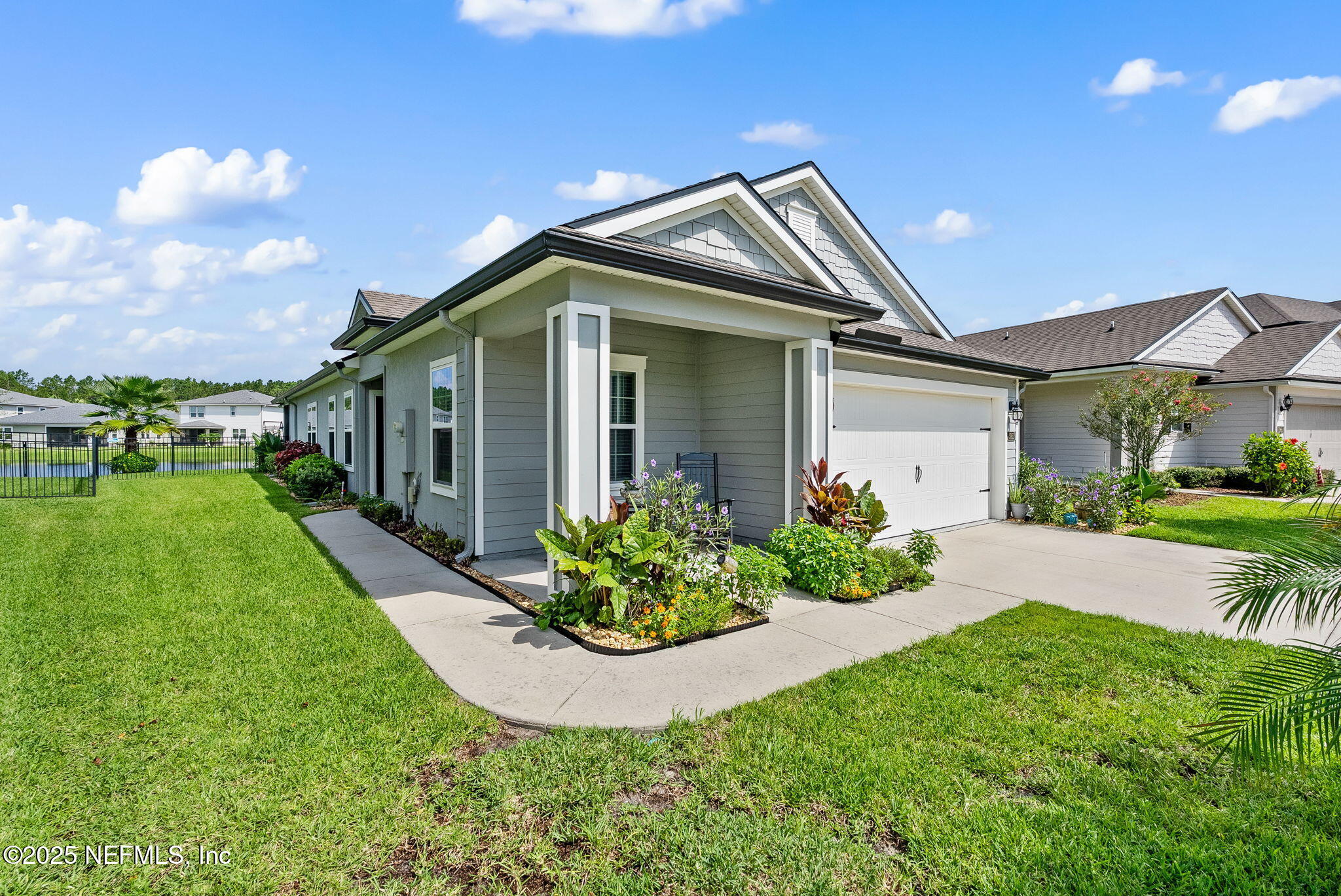 3961 Heatherbrook Place Middleburg, FL 32068 - Photo 2 of 28 a front view of a house with garden