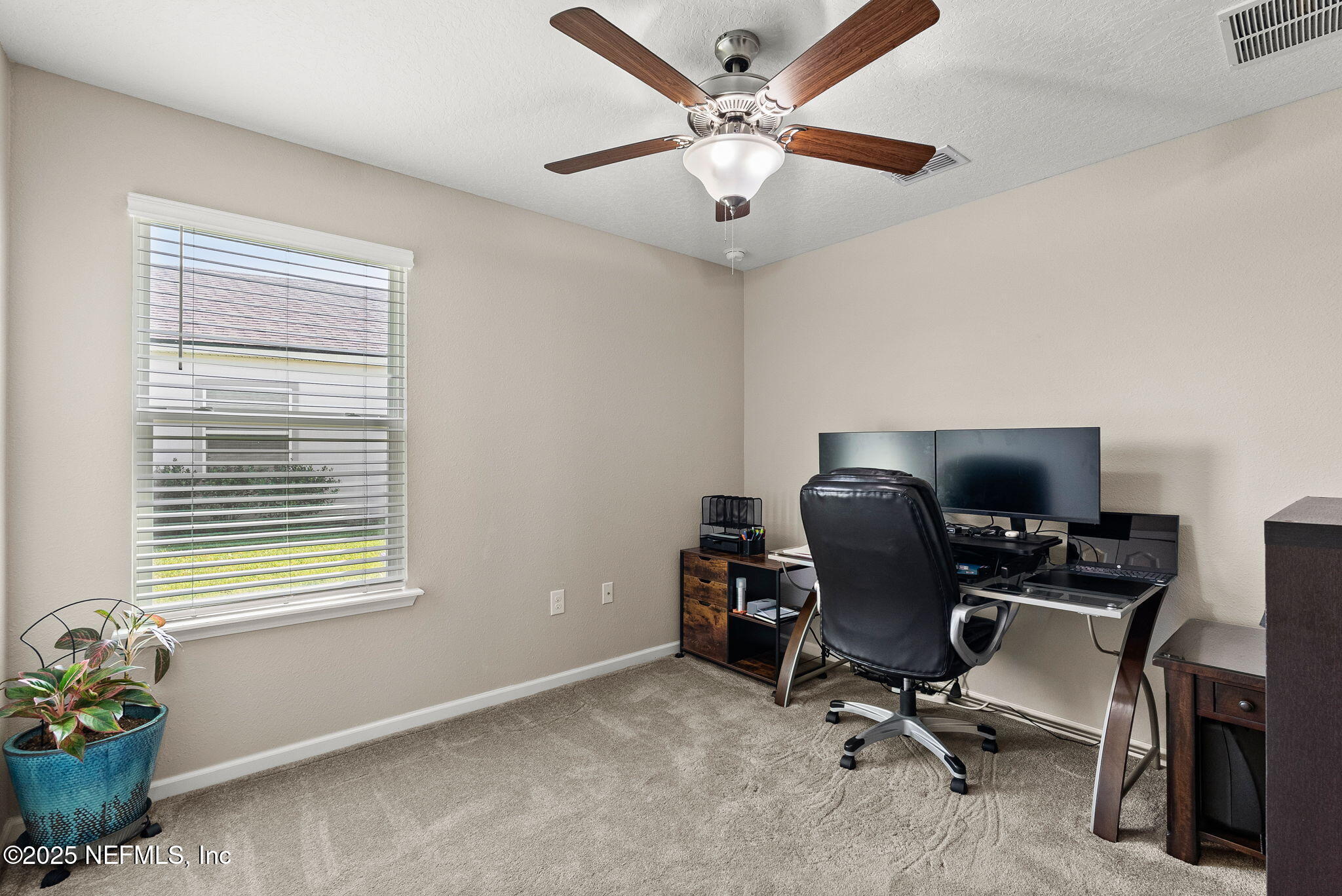 3961 Heatherbrook Place Middleburg, FL 32068 - Photo 21 of 28 a view of a workspace with furniture and a window