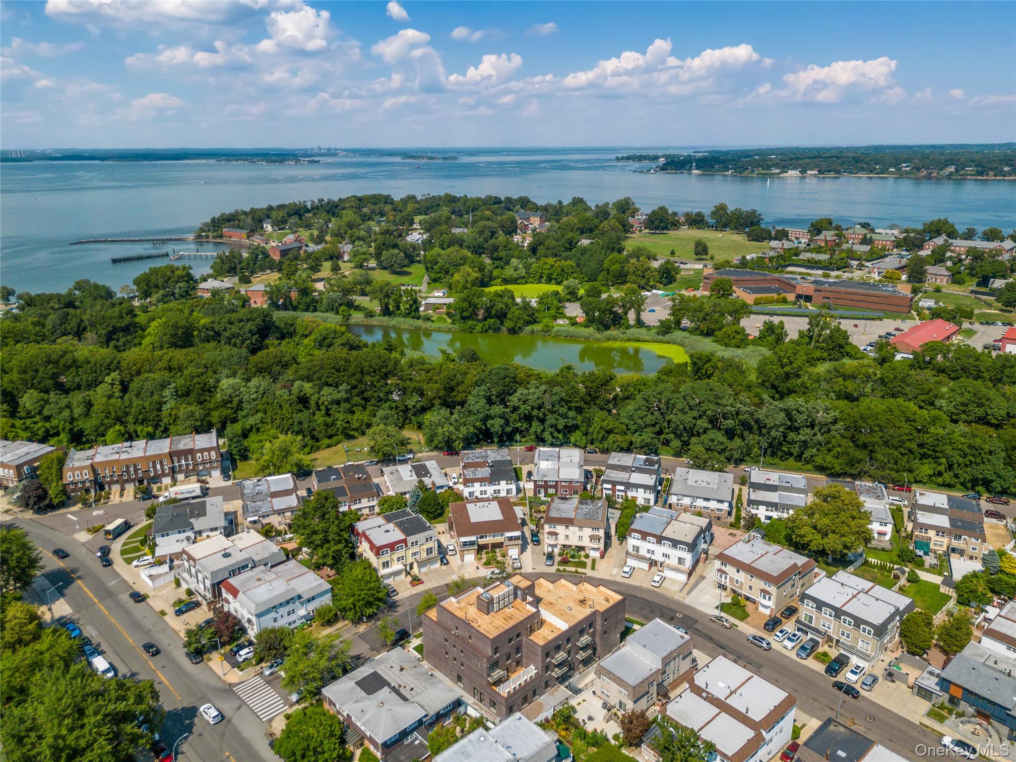 214-10 15th Avenue, Unit 3D & P6 Queens, NY 11360 - Photo 2 of 13 a view of a city with ocean view