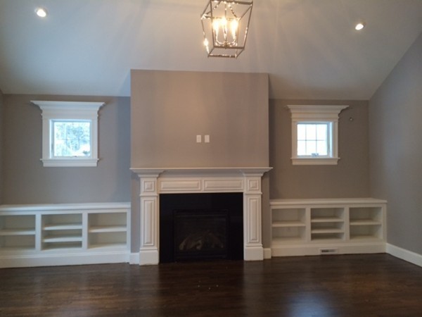 57 Upland Road Needham, MA 02492 - Photo 5 of 10 a living room with wooden floor and a fireplace