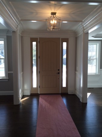 57 Upland Road Needham, MA 02492 - Photo 7 of 10 a view of a room with wooden floor and windows
