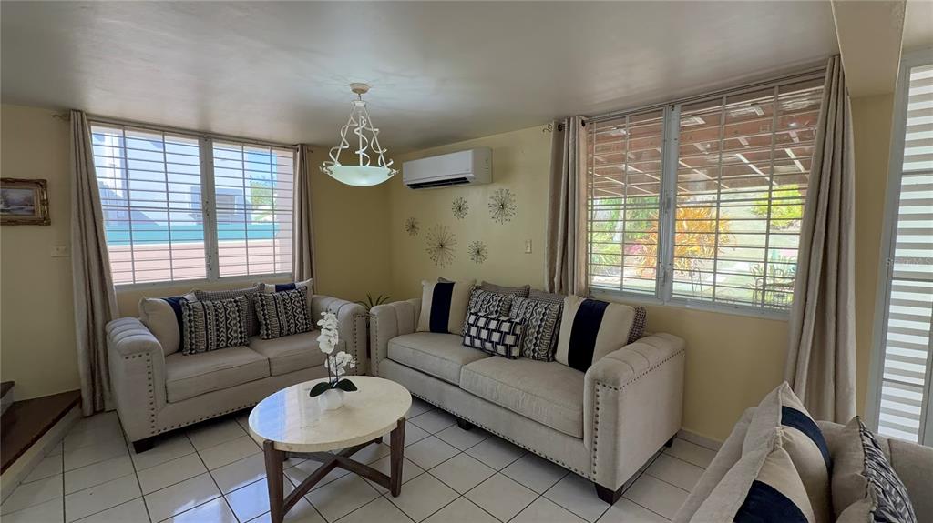 1 St Rio Grande, Unit B6 Rio Grande, PR 00745 - Photo 39 of 47 a living room with furniture and a large window
