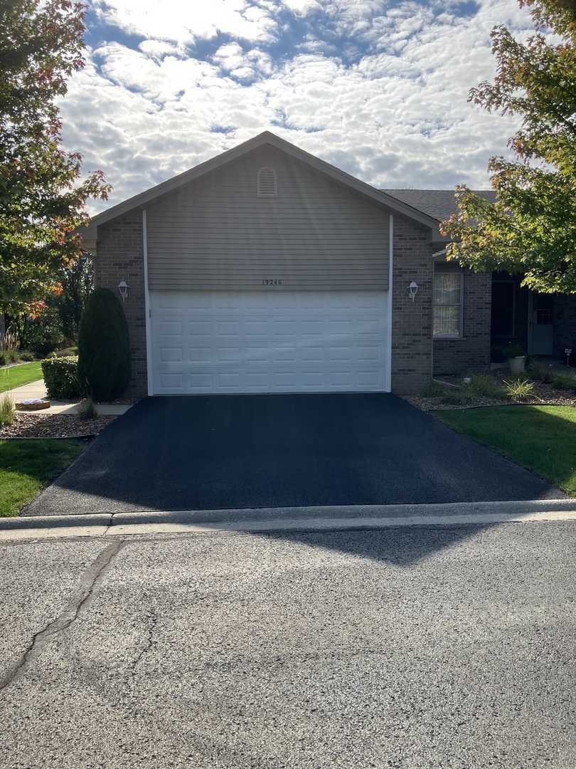 19246 104th Avenue Mokena, IL 60448 - Photo 1 of 38 a front view of house with garage