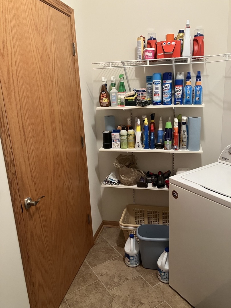 19246 104th Avenue Mokena, IL 60448 - Photo 12 of 38 a room with water heater and shelf