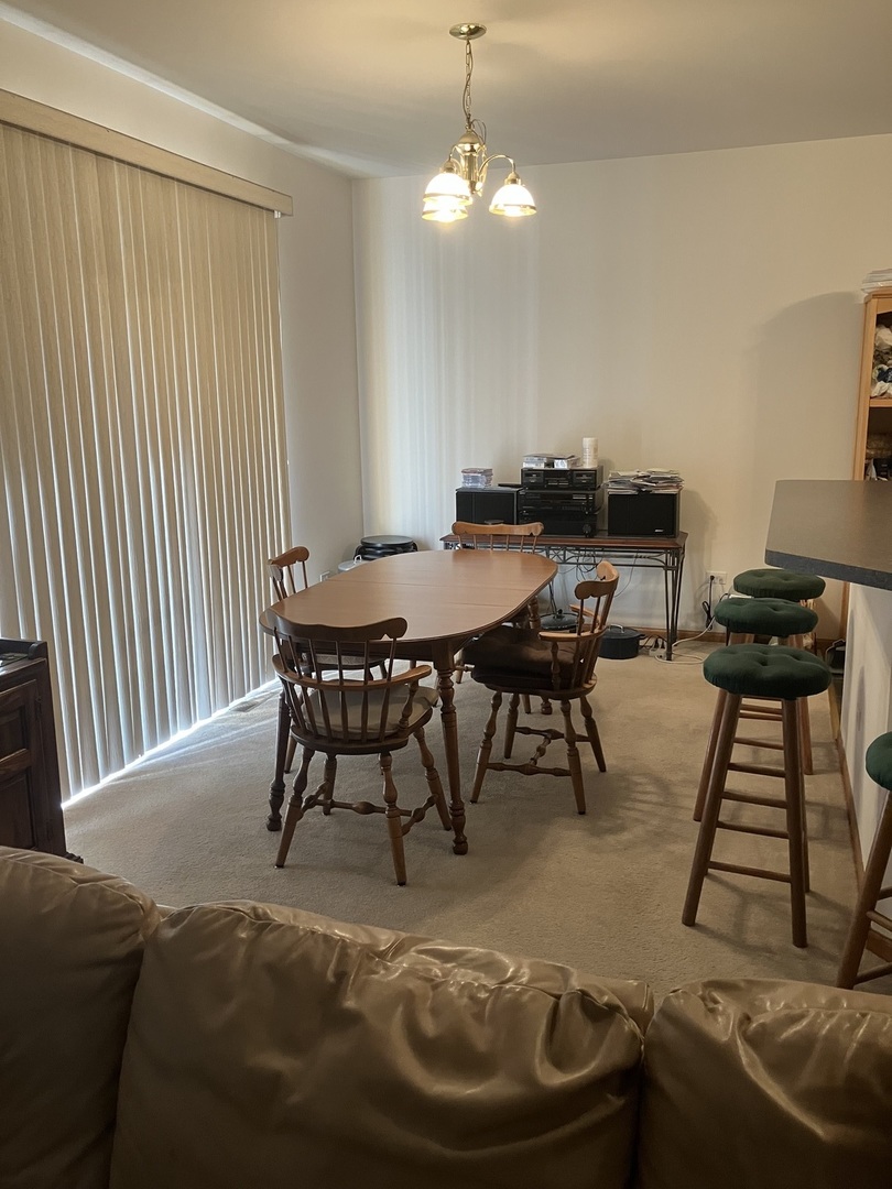 19246 104th Avenue Mokena, IL 60448 - Photo 20 of 38 a view of a dining room with furniture and wooden floor