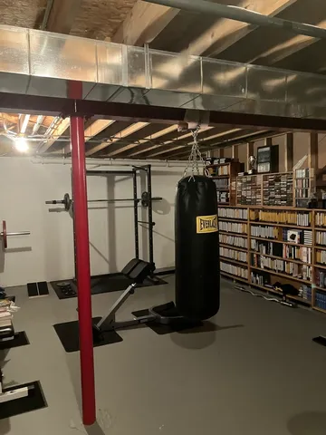 a bedroom with bed and a window