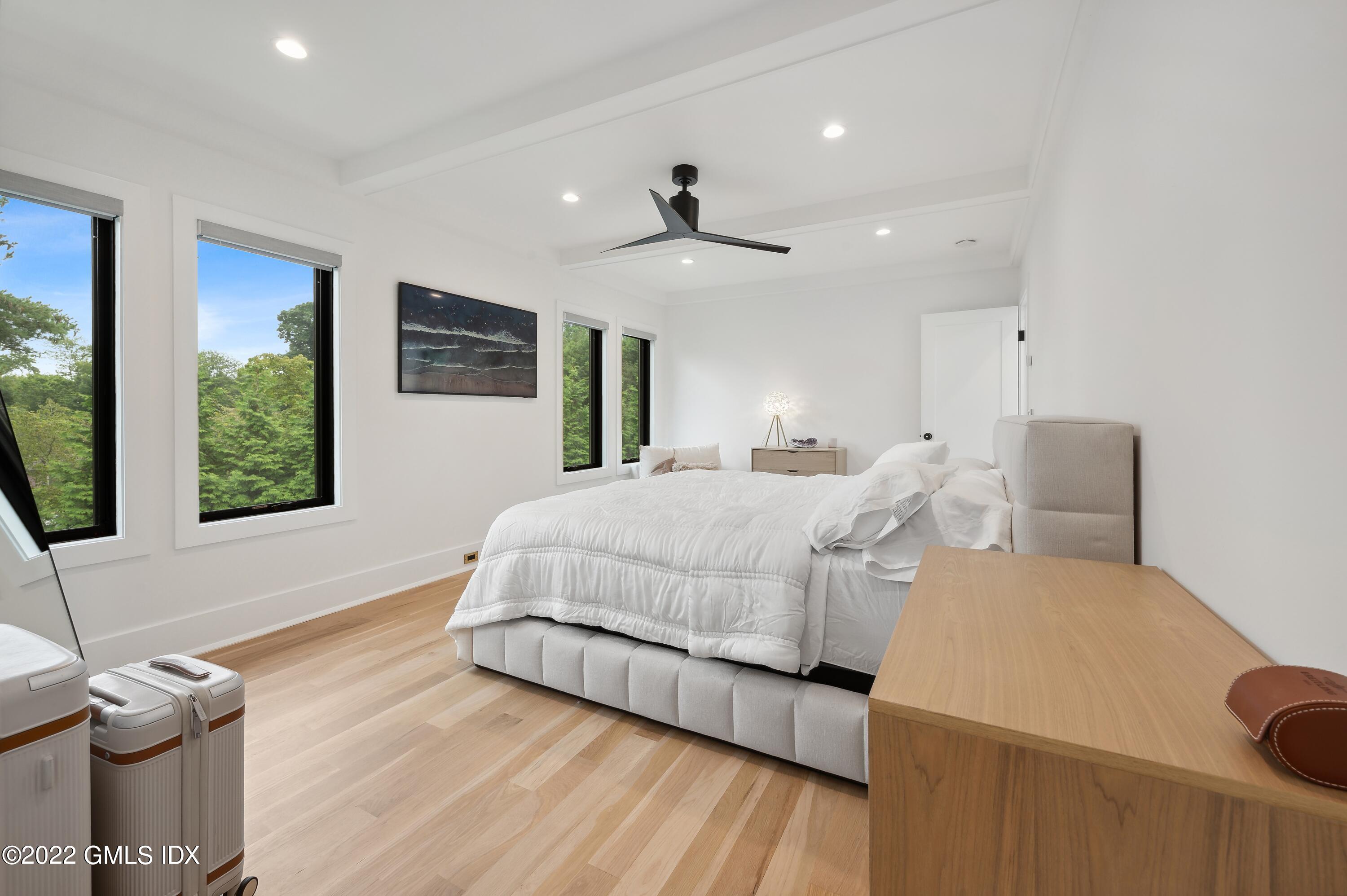 7 Drumlin Road Westport, CT 06880 - Photo 11 of 32 a bedroom with a bed and a flat screen tv