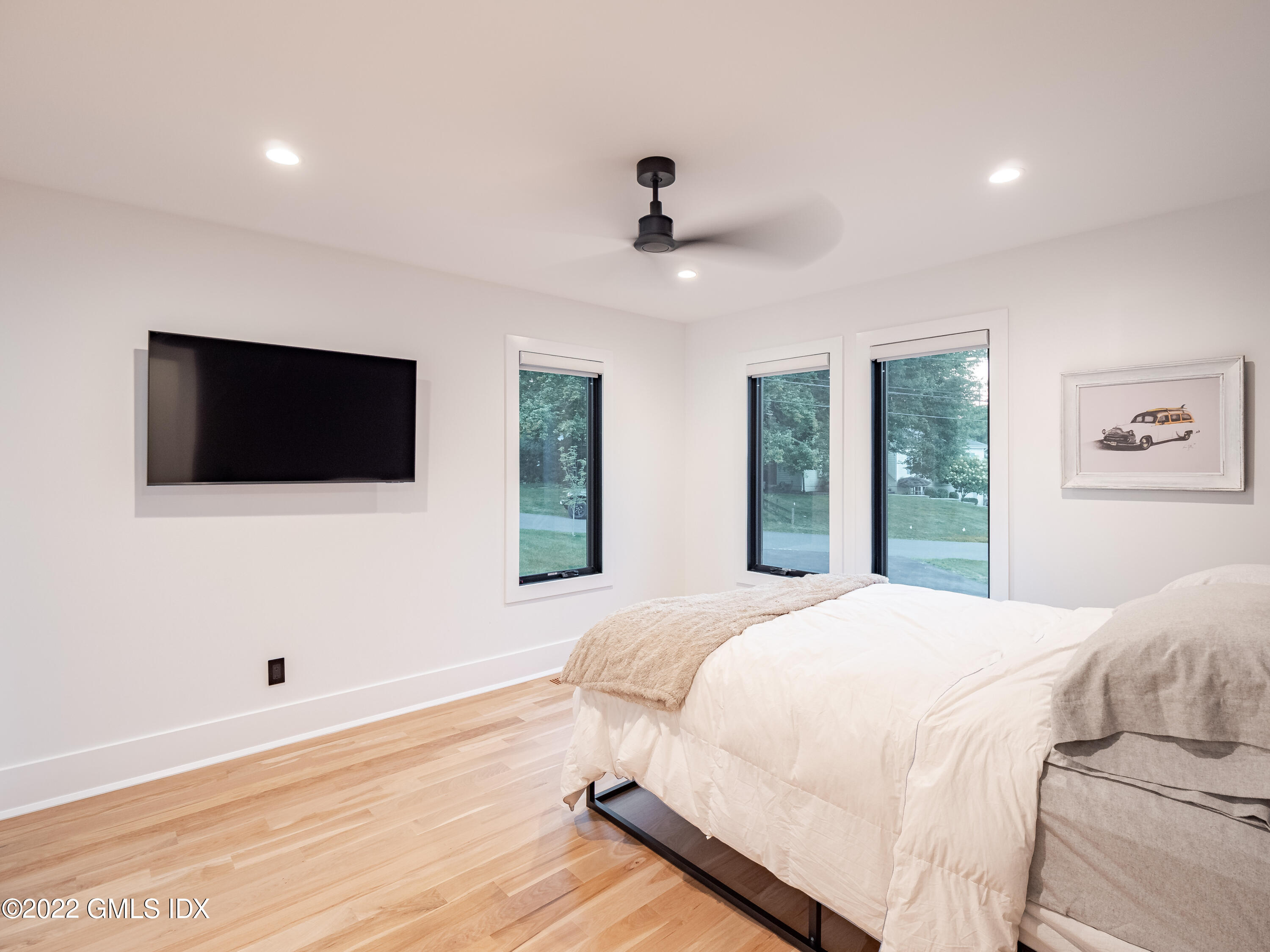 7 Drumlin Road Westport, CT 06880 - Photo 17 of 32 a bedroom with a bed tv and a window