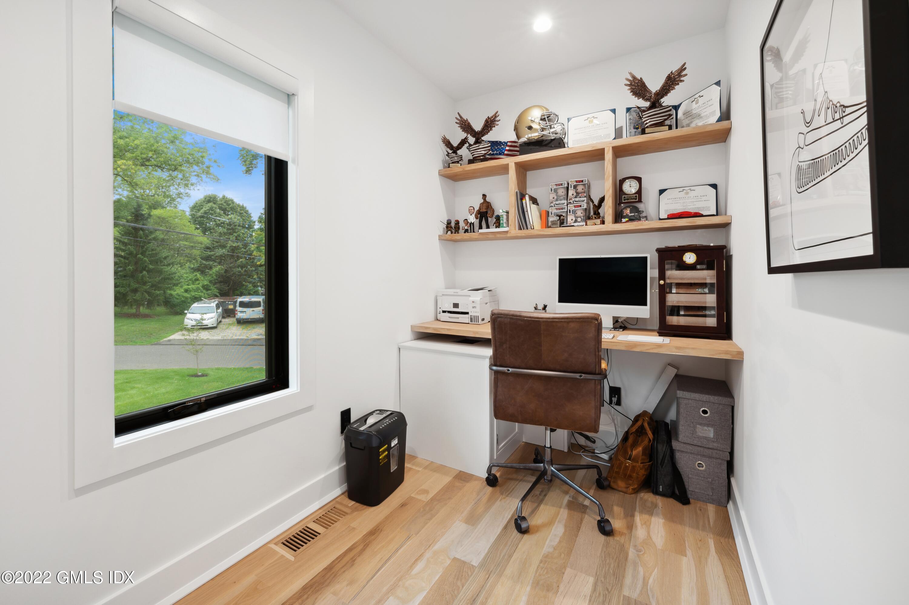 7 Drumlin Road Westport, CT 06880 - Photo 19 of 32 a view of a workspace with furniture and a window
