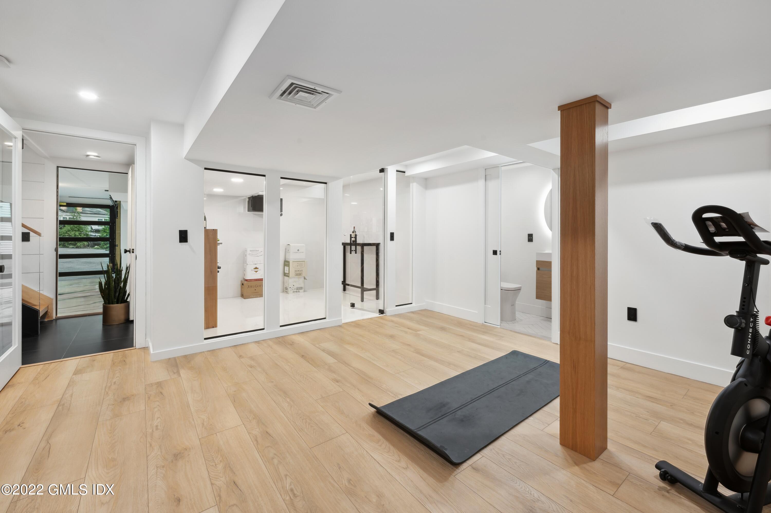 7 Drumlin Road Westport, CT 06880 - Photo 20 of 32 a view of a room with wooden floor and a bathroom