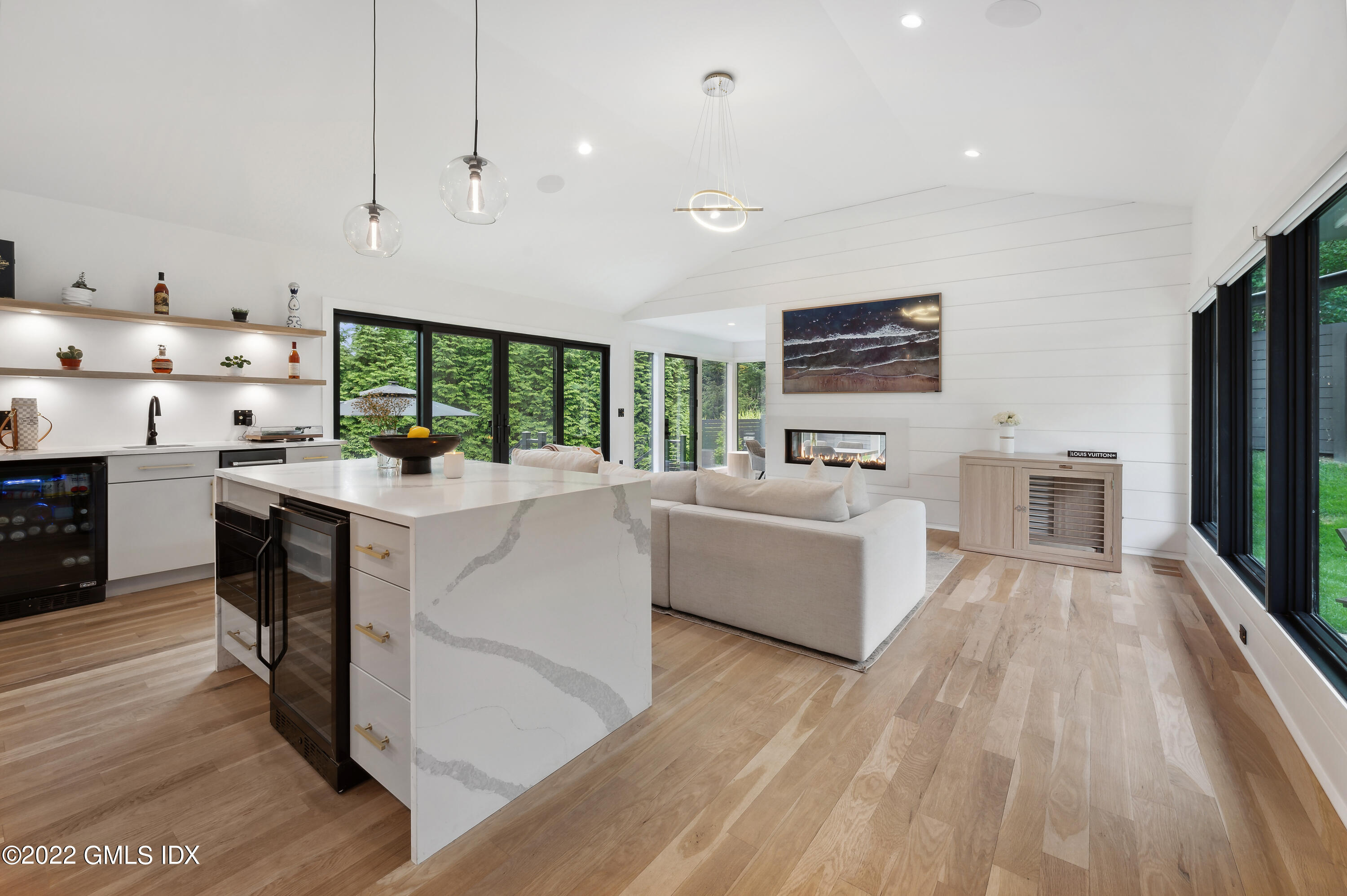 7 Drumlin Road Westport, CT 06880 - Photo 2 of 32 a living room with furniture flat screen tv and a wooden floor