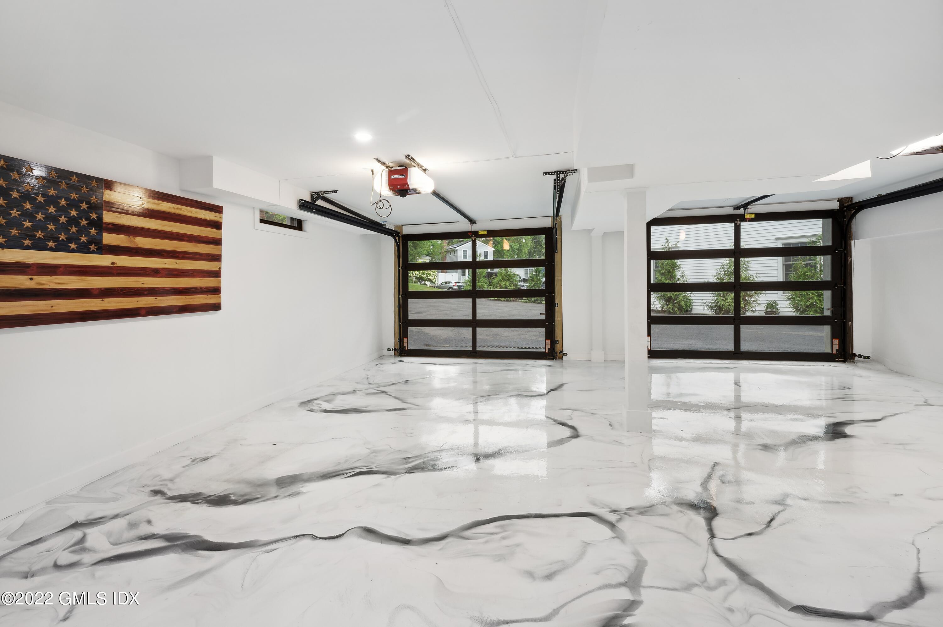 7 Drumlin Road Westport, CT 06880 - Photo 23 of 32 a view of a livingroom with wooden floor and a large windows