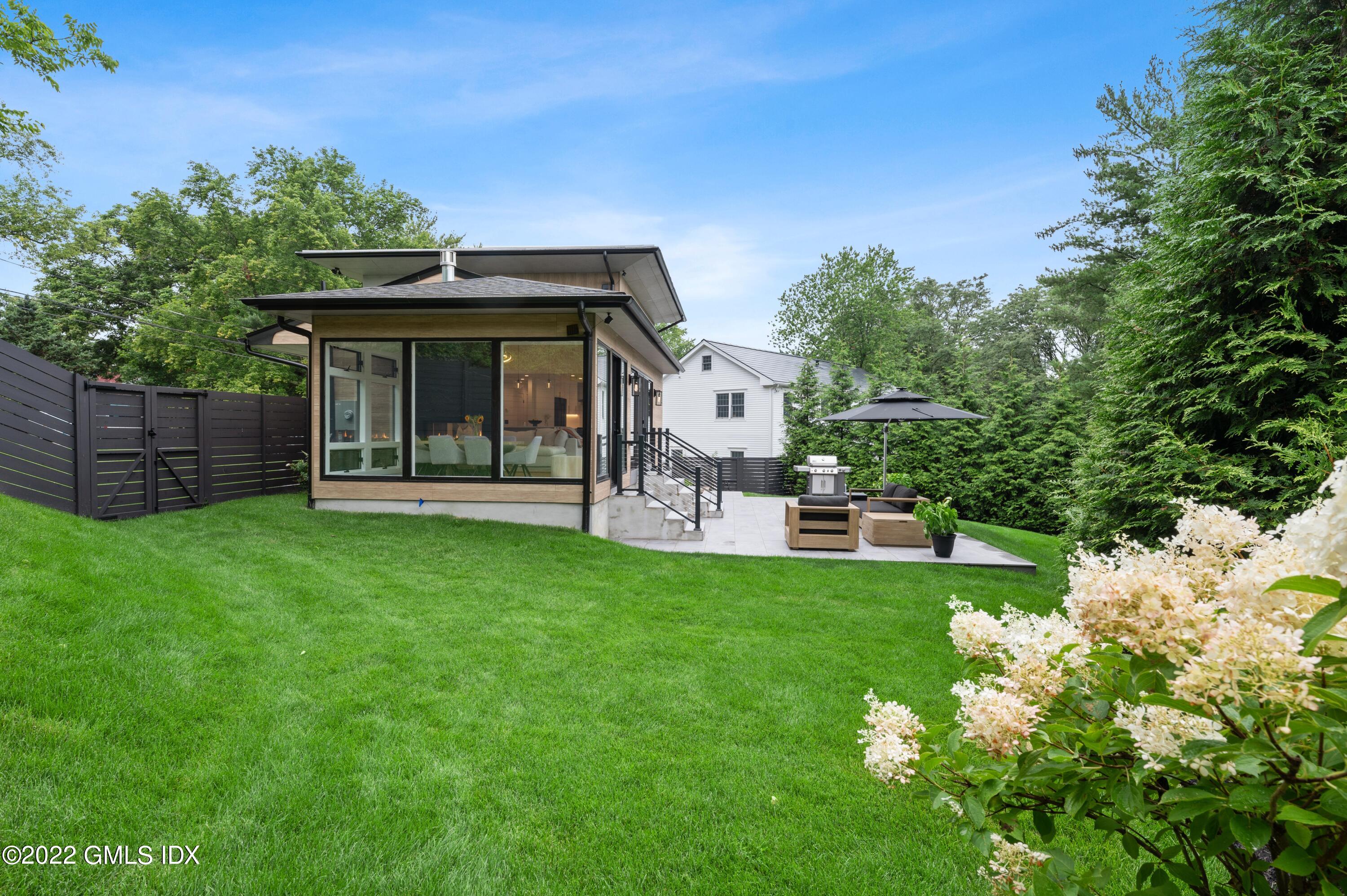 7 Drumlin Road Westport, CT 06880 - Photo 26 of 32 a view of a house with a backyard