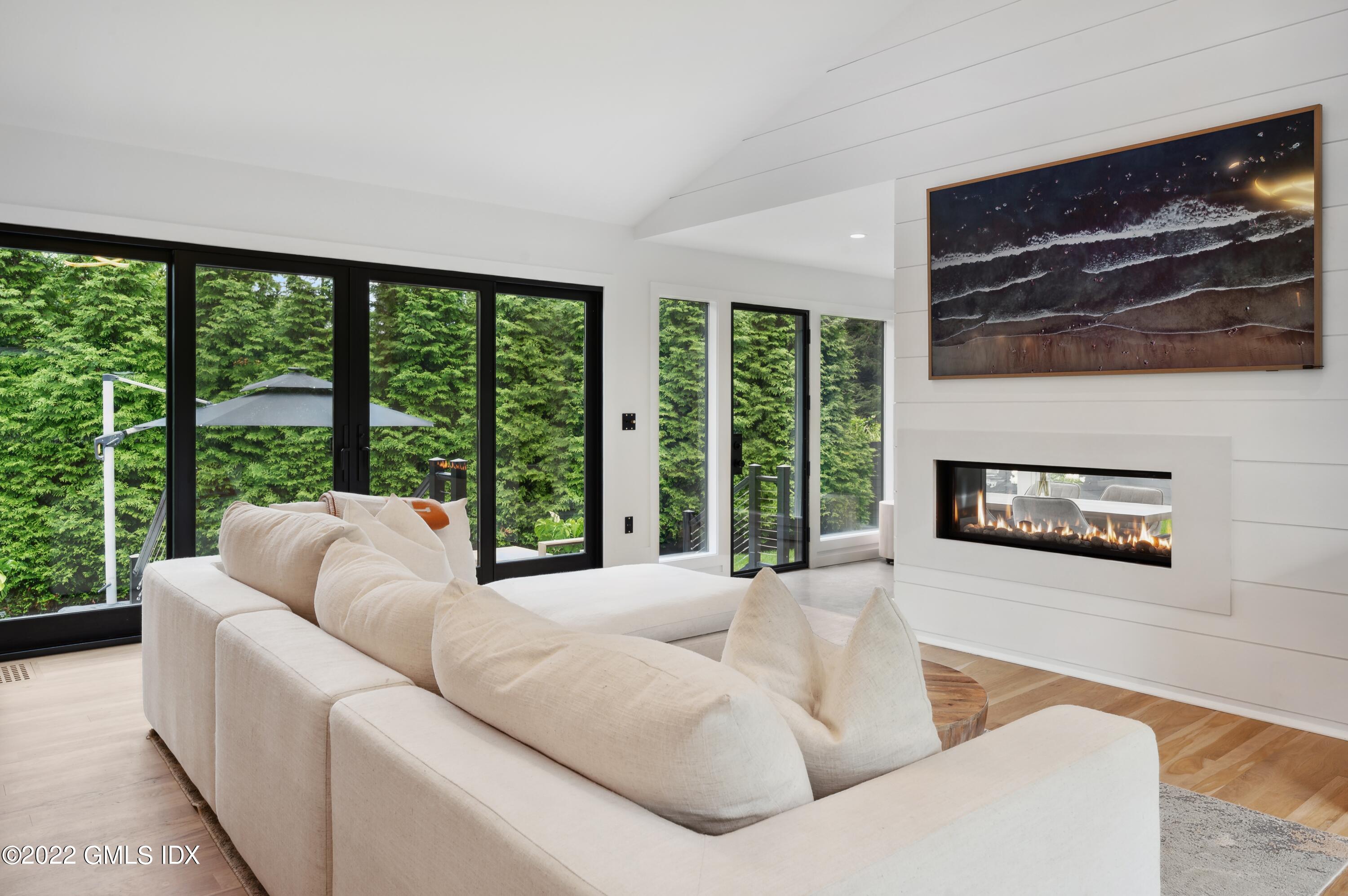 7 Drumlin Road Westport, CT 06880 - Photo 4 of 32 a living room with furniture and a floor to ceiling window