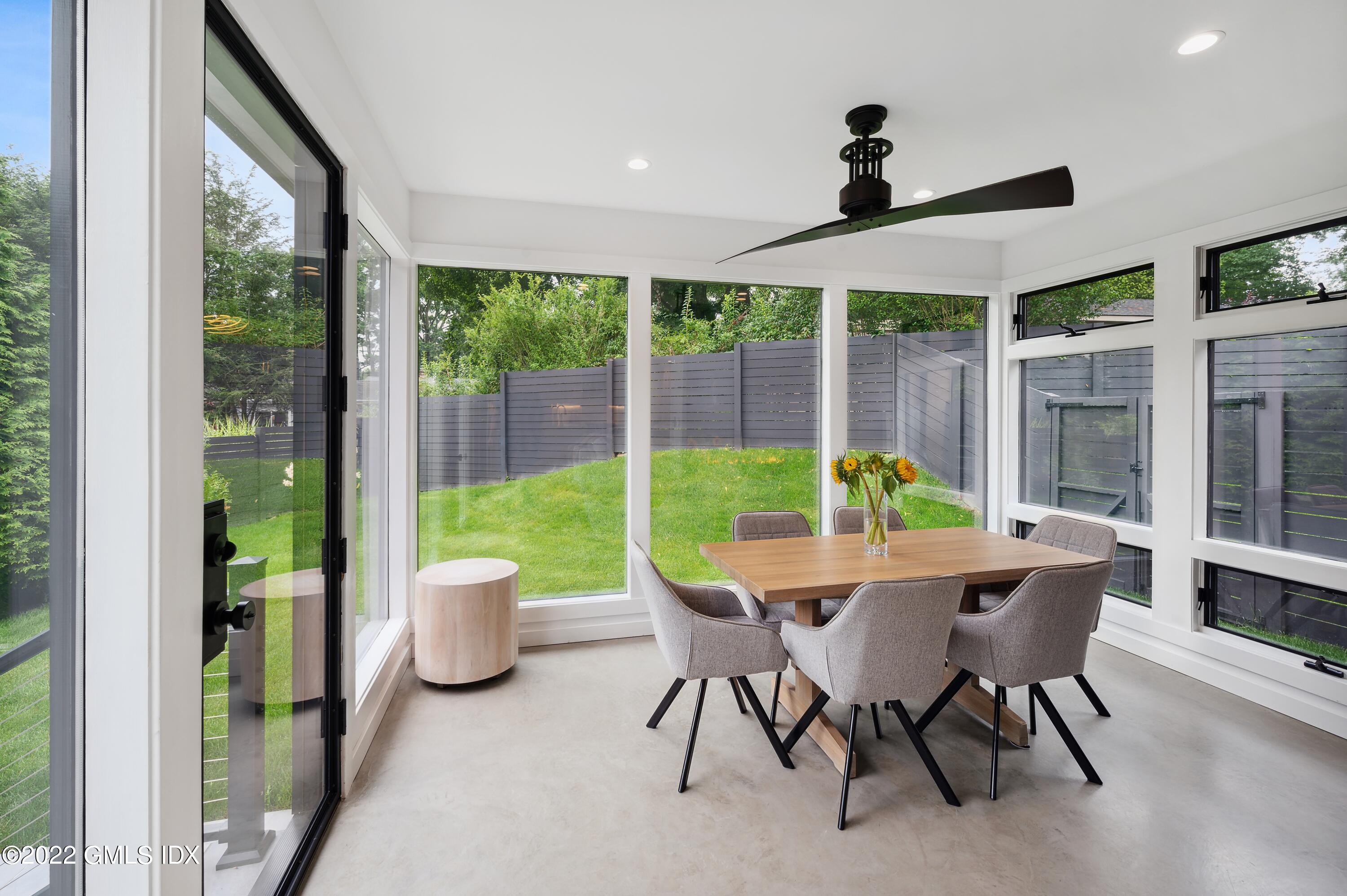 7 Drumlin Road Westport, CT 06880 - Photo 5 of 32 a dining room with furniture mountain view and a garden