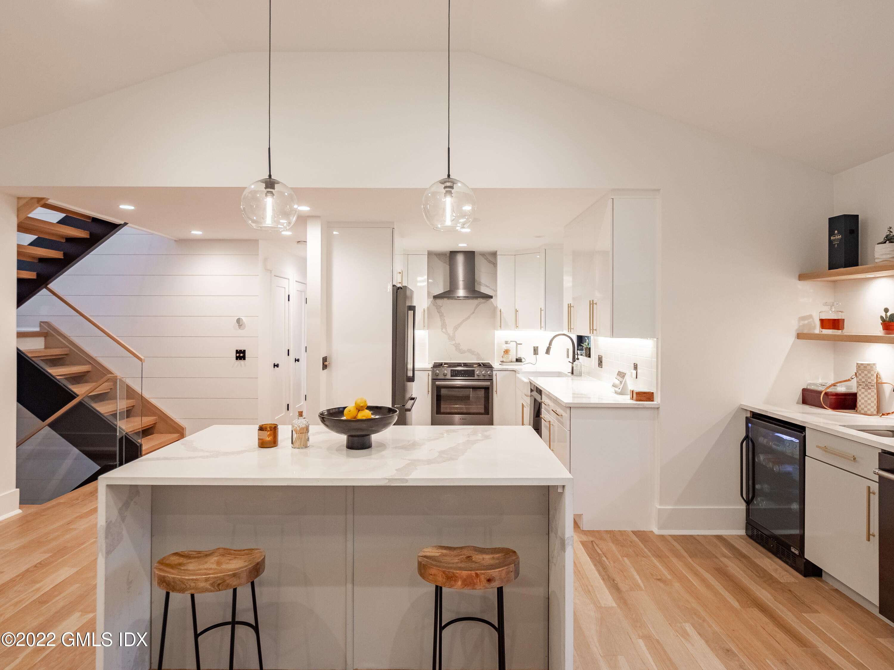 7 Drumlin Road Westport, CT 06880 - Photo 9 of 32 a kitchen with a sink a stove and chairs
