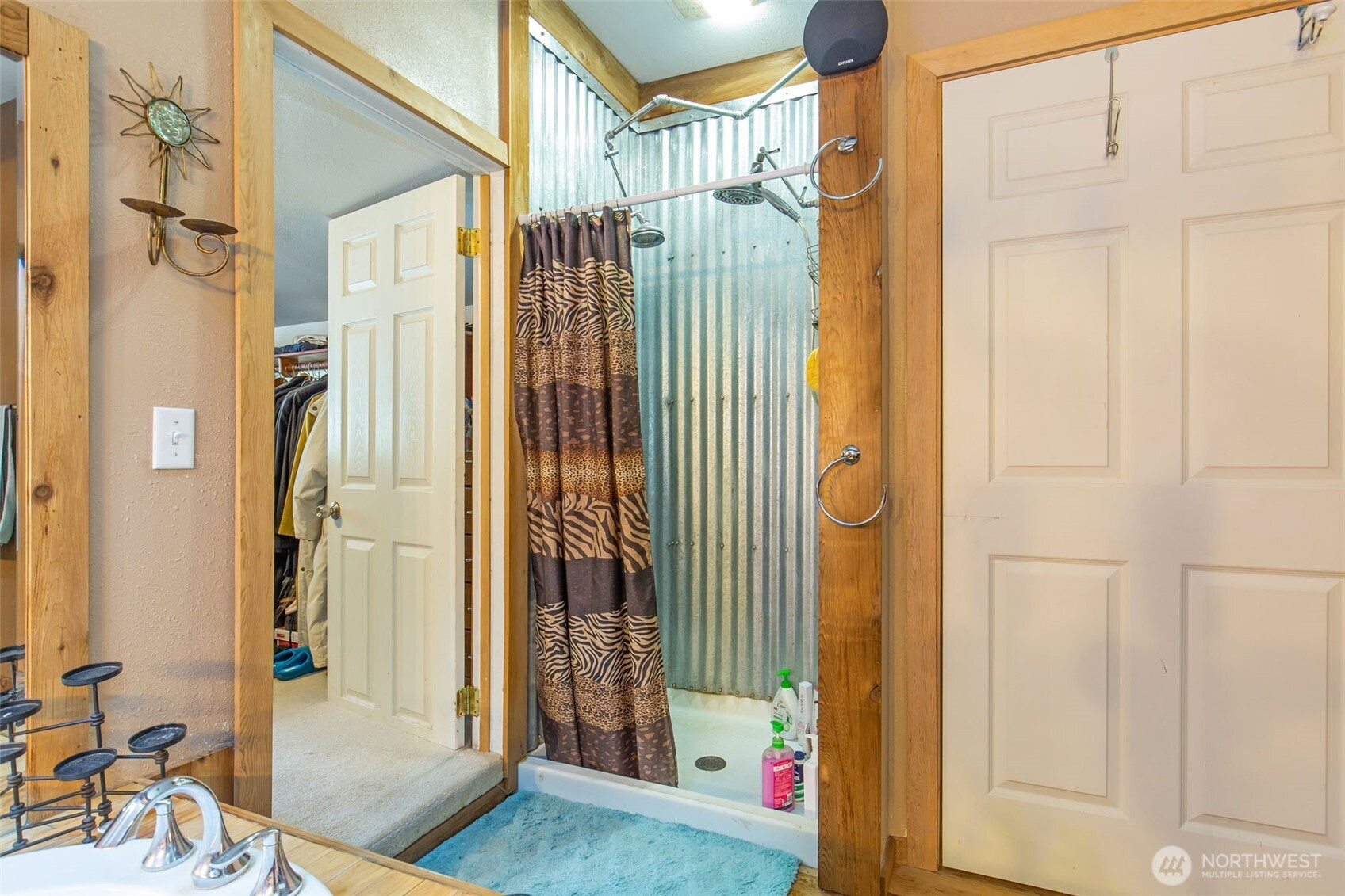 1497 Old Military Road Southeast Tenino, WA 98589 - Photo 21 of 34 a view of a bathroom with a shower and a sink