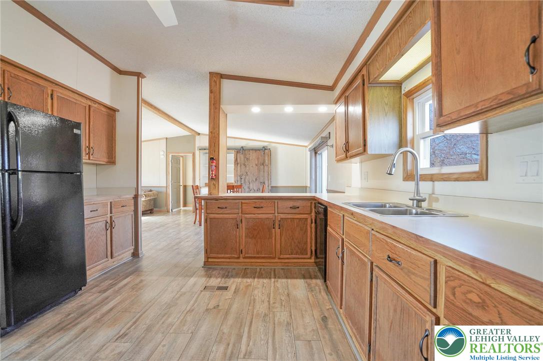 7221 Borman Road New Tripoli, PA 18066 - Photo 20 of 62 a kitchen with stainless steel appliances a refrigerator and a sink