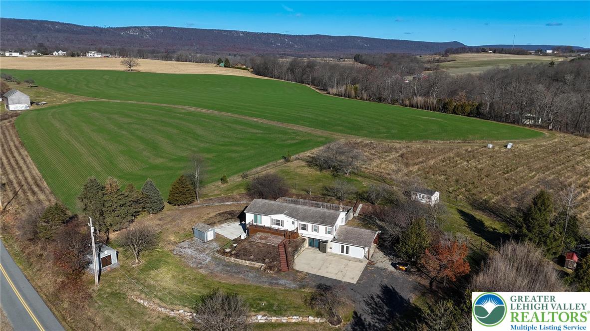 7221 Borman Road New Tripoli, PA 18066 - Photo 2 of 62 a view of a lake with a mountain in the back