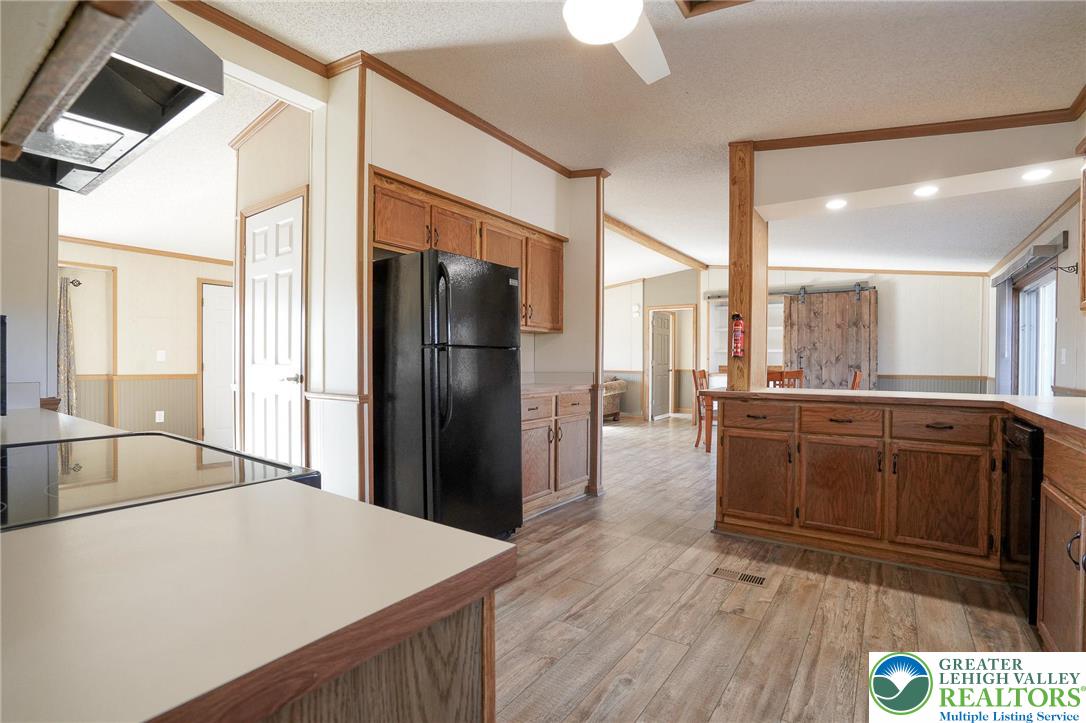 7221 Borman Road New Tripoli, PA 18066 - Photo 21 of 62 a kitchen with stainless steel appliances a refrigerator and a sink