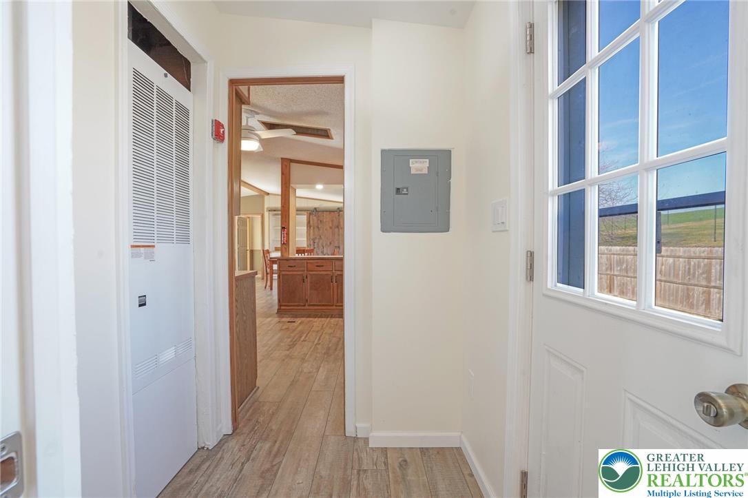 7221 Borman Road New Tripoli, PA 18066 - Photo 26 of 62 a view of a hallway with wooden floor and windows